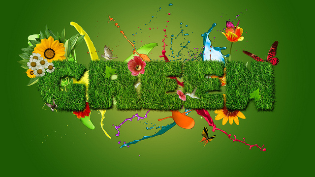 The letters of the word 'Green' looking like a hedge among a riot of colour