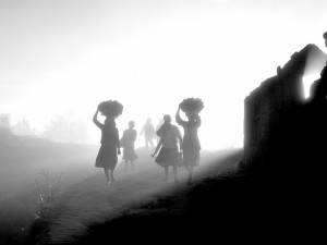 People in Madagascar walking in a mist