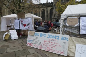 Tents and signs by Sheffield cathedral