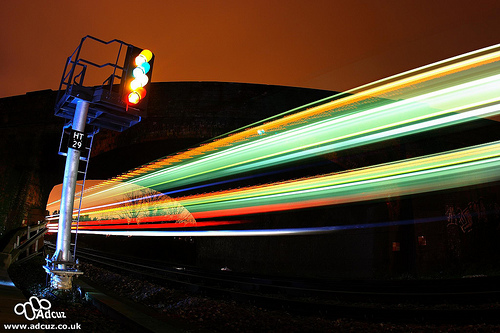 long exposure of two trains on a railway line at night.