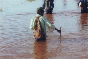 Children crossing flooded plains on their way to school. Photo: Money for Madagascar