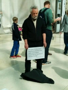 A Quaker stands in silence at the British Museum. 