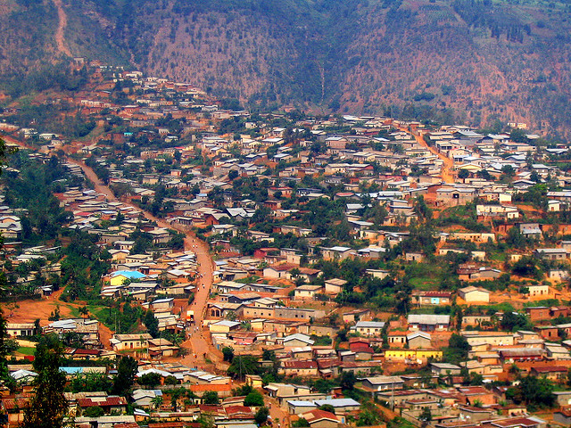 A hill in Kigali covered with houses.