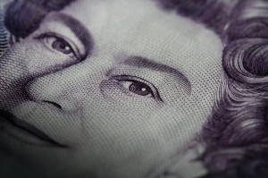 Part of the British queen's face from a bank note, showing her eyes.